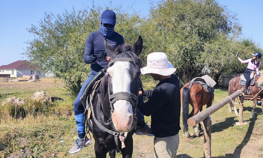 Kyrgyzstan Horse Riding Day 1 - Daniel mounting